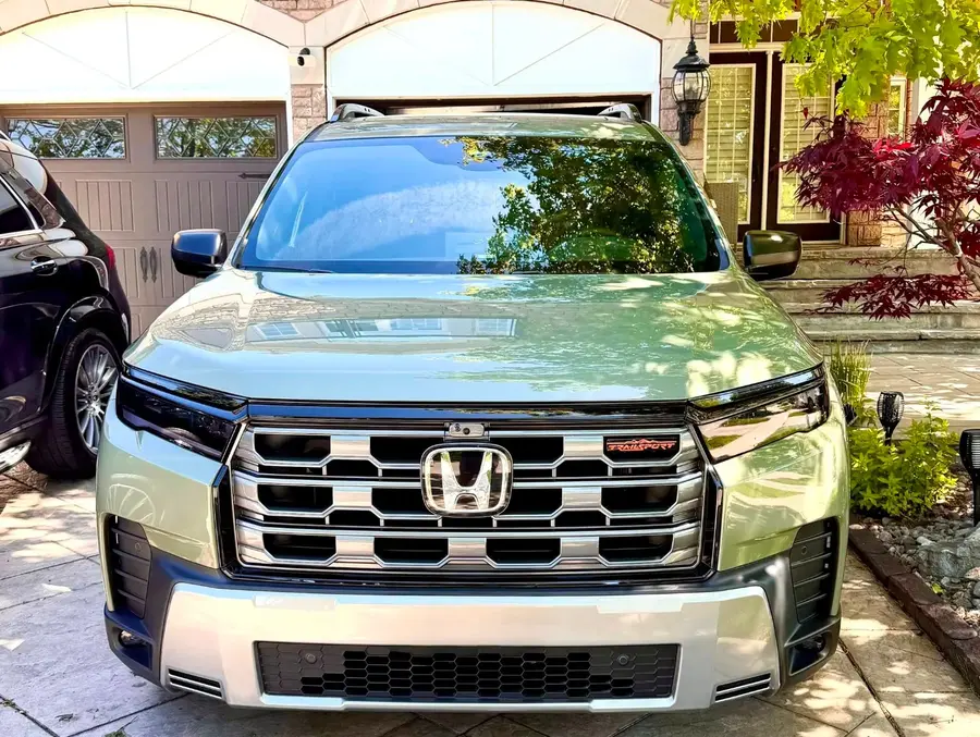 Honda Pilot Ash Green Metallic Shown its Front Grille