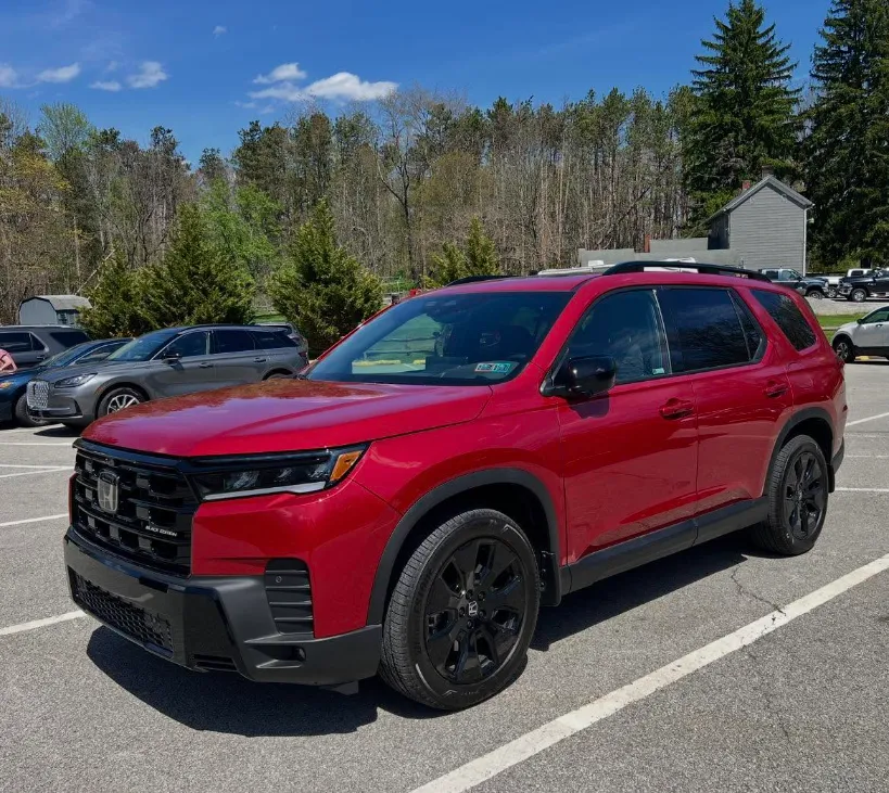 Honda Pilot Shown in Radiant Red Metallic II During Daylight