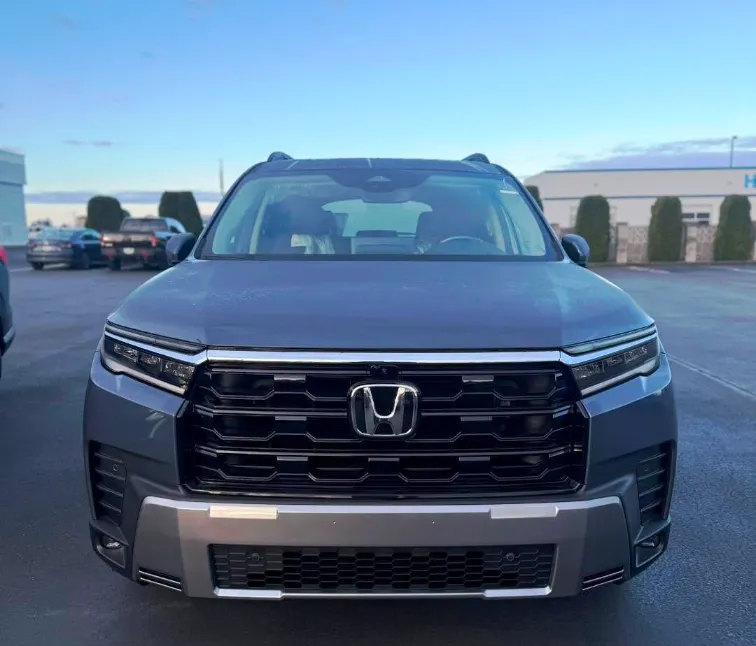 Honda Pilot Shown in Smoke Blue Pearl Showing it New Grille Design