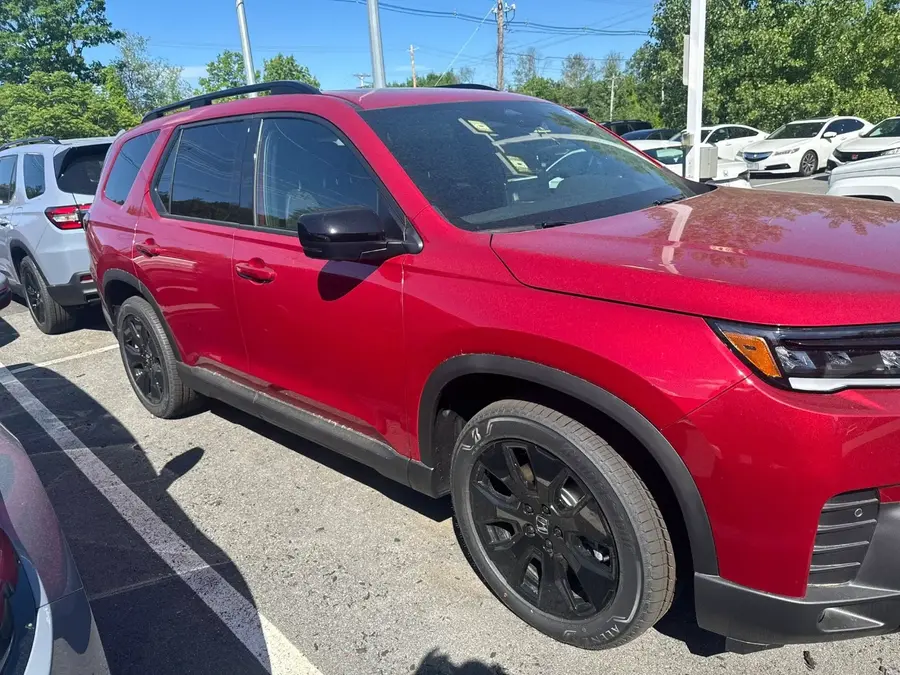 Honda Pilot with Radiant Red Metallic II During Daylight